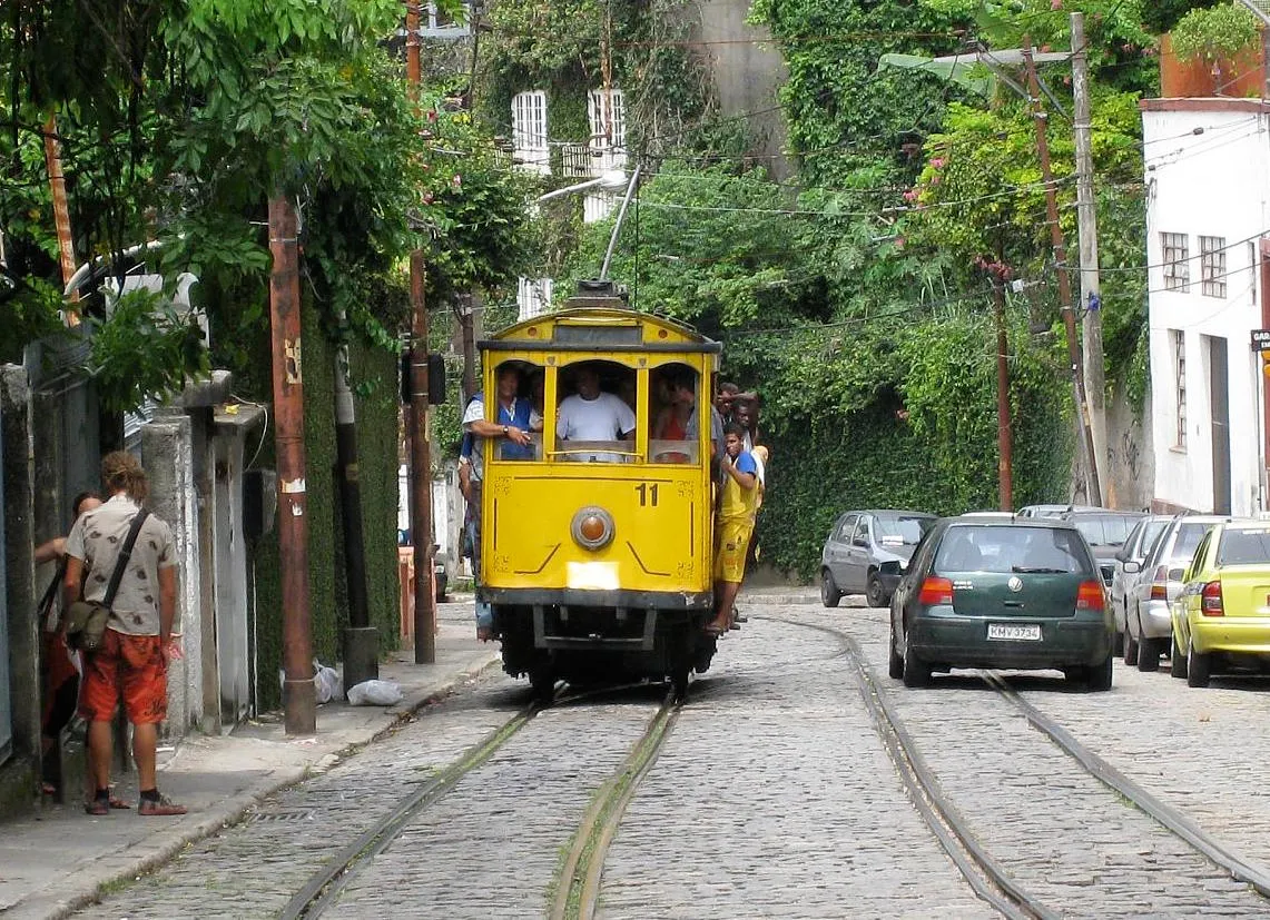 The yellow Santa Teresa tram on a cobbled street