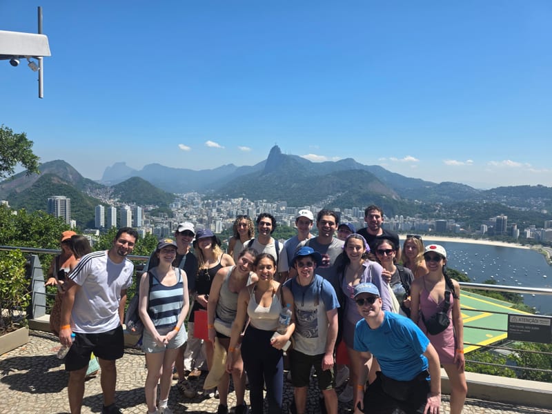 A Trip in Brazil tour group at a Rio viewpoint with Christ the Redeemer behind